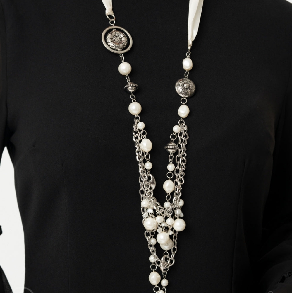 long whit multi strand pearl necklace with white ribbon